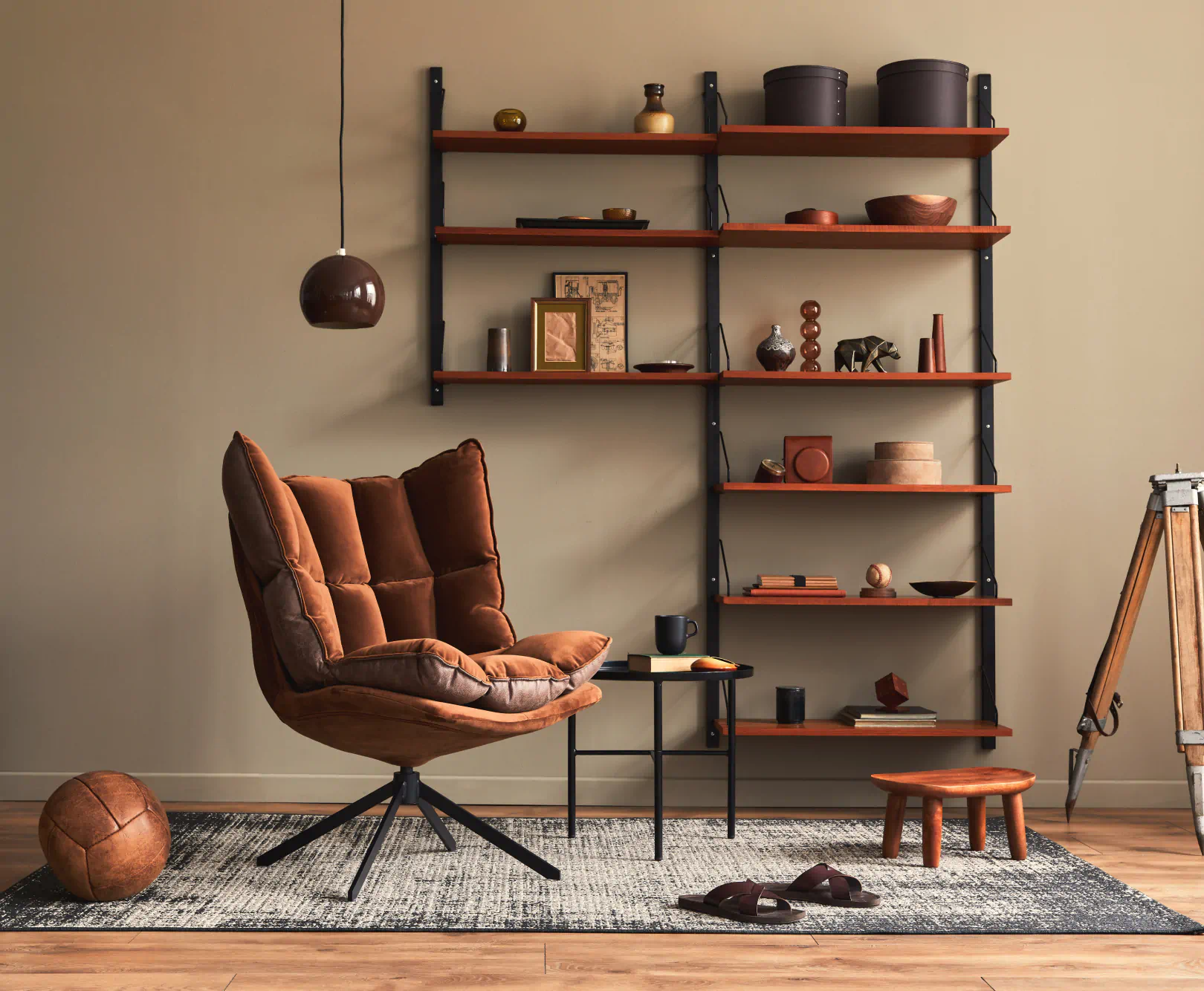 A collection of brown furniture and various items sit in a room, all perfectly matching one another.