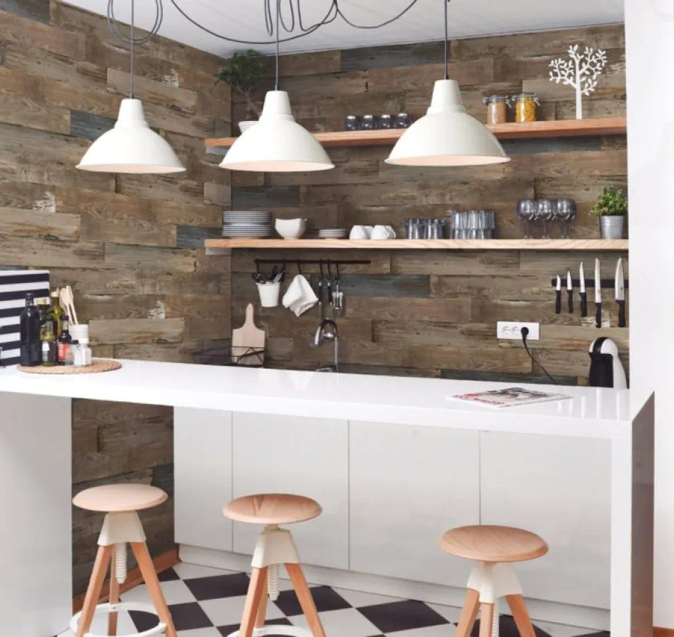 Interior with wood accents and checkered floor with 3 stools