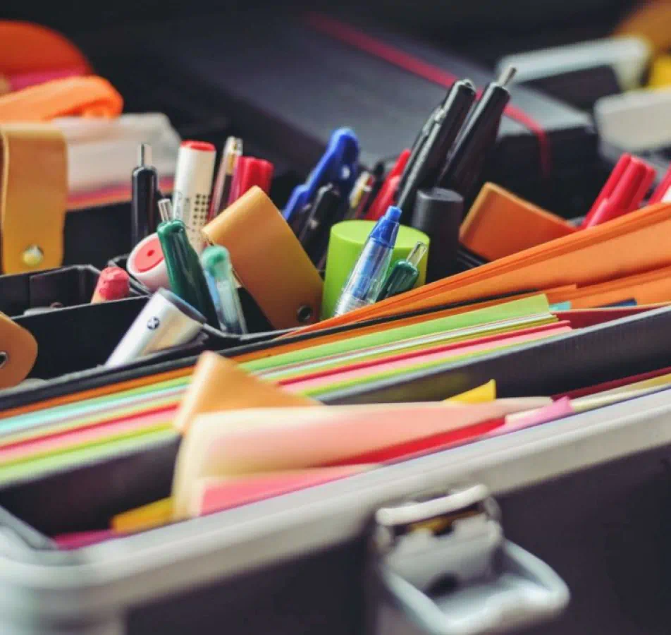 Brightly colored office supplies in a holder