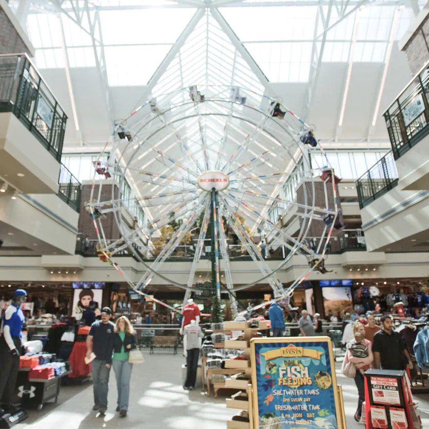 Large ferris wheel in a great indoor shopping area.