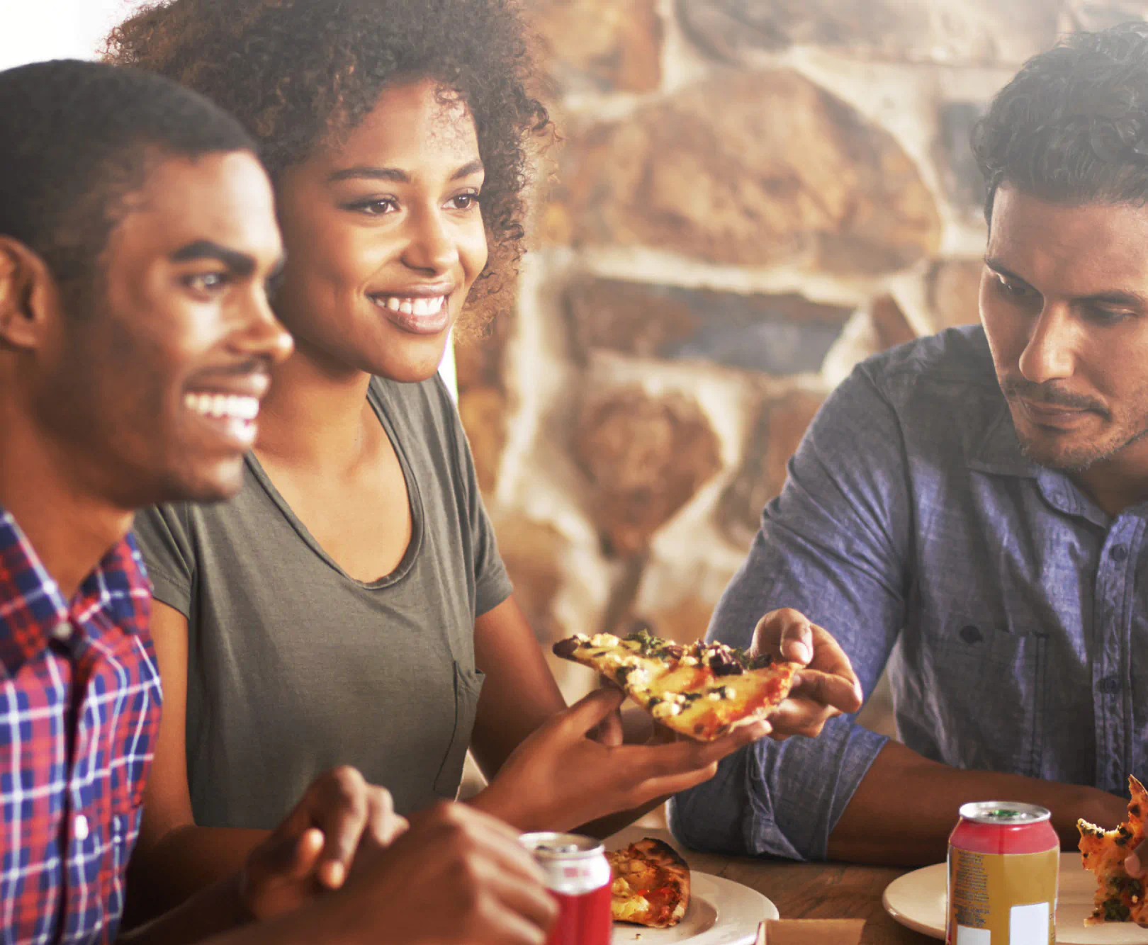 Friends eating pizza at a resturant