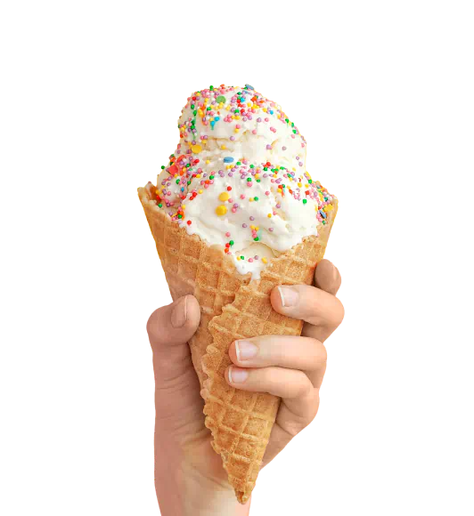 A hand holds a large cone of vanilla ice cream covered in rainbow sprinkles.